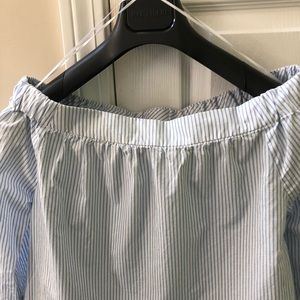 Off shoulders shirt.